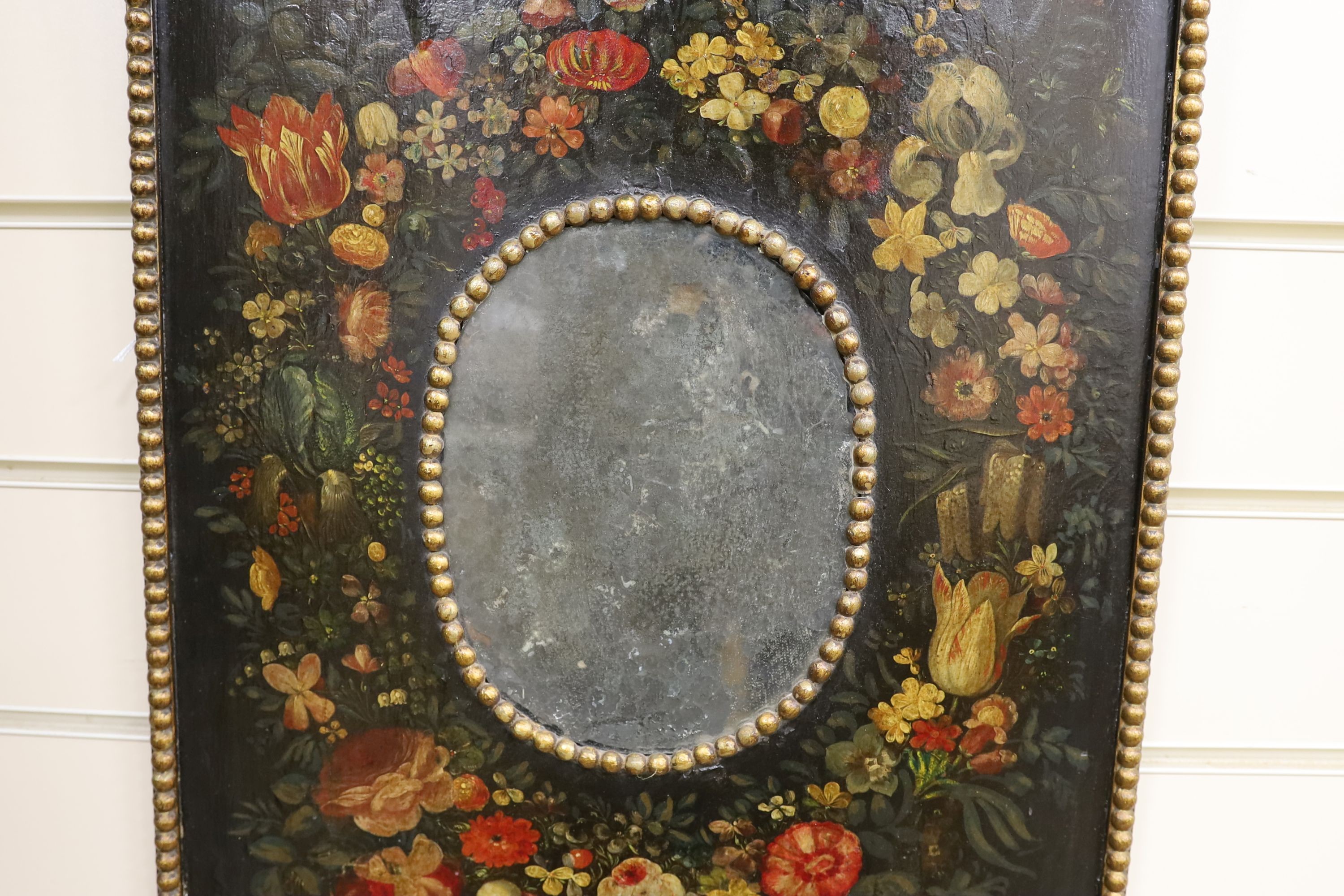 A small 18th century and later rectangular Dutch painted wall mirror